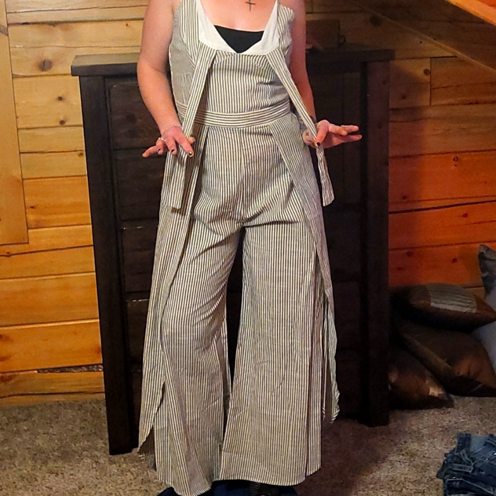 Fun, sexy, striped jumpsuit. Has high slit up sides of legs, ties in front.
